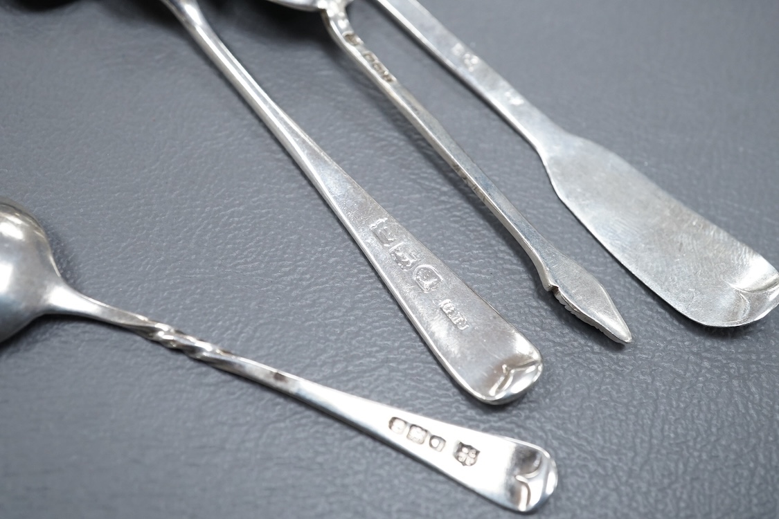 Four assorted silver napkin rings, two cased sets of six silver spoons, four silver condiments including a pair, a small group of sundry flatware, a silver wine label and a plated napkin ring.
